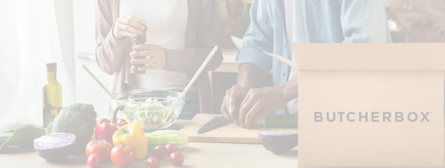 two people cooking in the kitchen